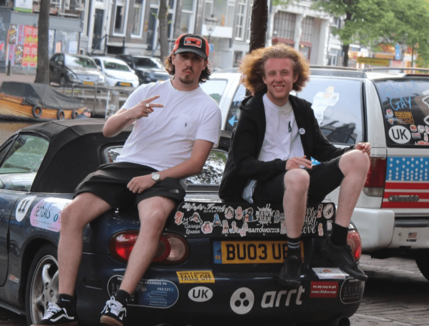 Lewis and Ross sitting on the back of the MX-5.